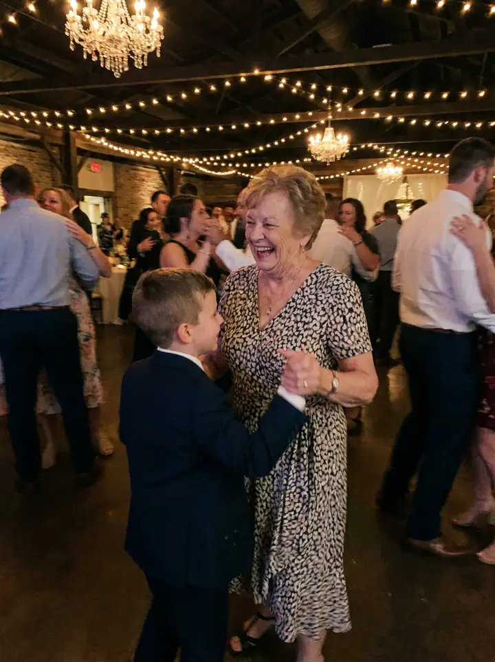 A grandmother dancing with her grandson