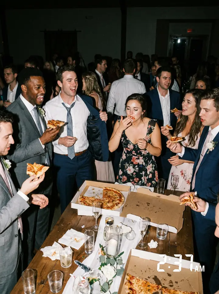 Guests eating pizza late at night